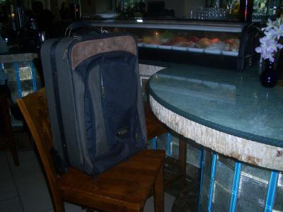 Suitcase orders sushi