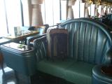 Suitcase chillin in a posh chair