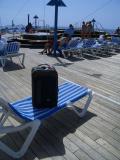 Suitcase relaxing by the aft pool and hot tub