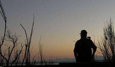 Camera: C750 
I introduced my 84 year old father to digital photography two years ago. We have since spent many quality hours together, thanks to this wonderful hobby. He is often the subject of many of my pictures, such as this sunset/moonset shot.
