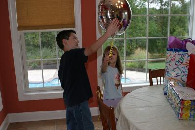 Noah showing her the personalized balloon