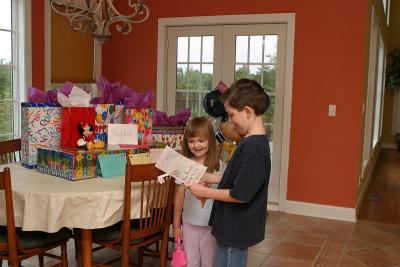 Noah reading his home-made card to her