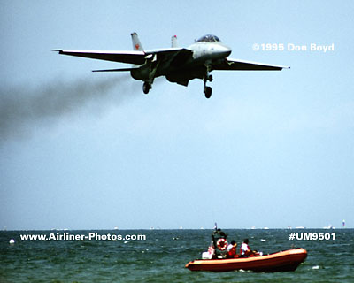 1995 - USN F-14 Tomcat and USCG crew and boat aviation stock photo #UM9501