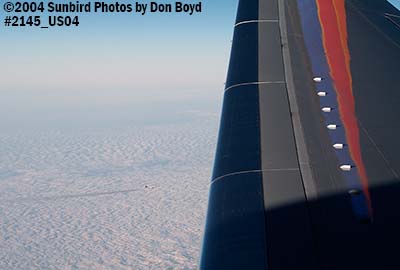 Passing airliner off the right wing of Southwest Airlines B737-7H4 aviation airline stock photo #2145