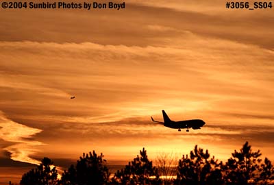Southwest Airlines B737-7H4 on approach at sunset aviation airline stock photo #3056