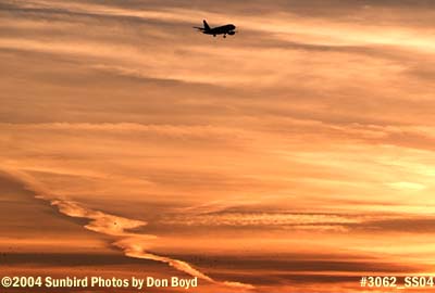 Frontier Airlines A319 on approach at sunset aviation airline stock photo #3062_SS04
