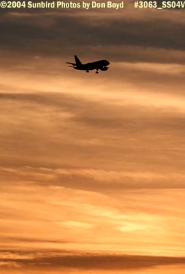 Frontier Airlines A319 on approach at sunset aviation airline stock photo #3063