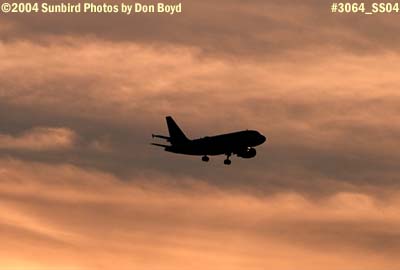 Frontier Airlines A319 on approach at sunset aviation airline stock photo #3064