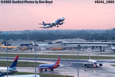 Runway incursion - Delta Airlines B757-232 N623DL not clear of runway 9-left as Spirit A-321 lifts off stock photo #6341