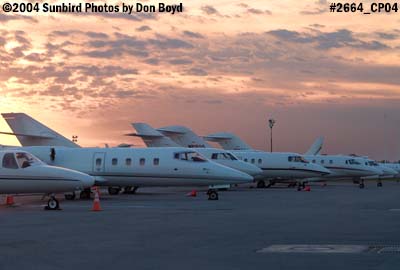 Numerous corporate jets at sunset aviation stock photo #2664
