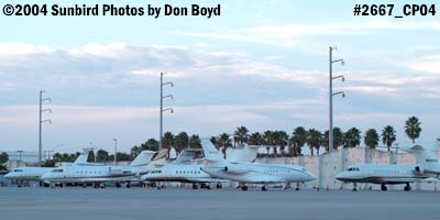 Numerous corporate jets on the ramp at sunset aviation stock photo #2667