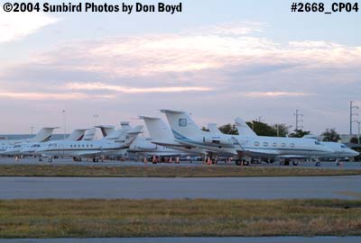 Numerous corporate jets on the ramp at sunset aviation stock photo #2668