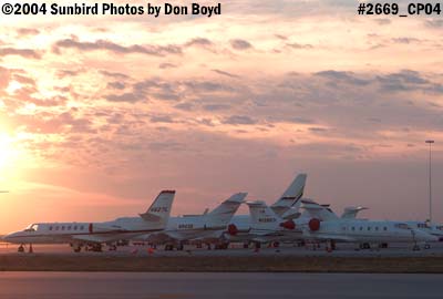 Numerous corporate jets on the ramp at sunset aviation stock photo #2669
