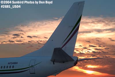Tail of Miami Air International's B737-8Q8 N734MA on the ramp at sunset aviation stock photo #2681