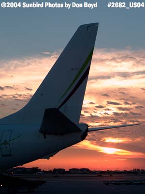 Tail of Miami Air International's B737-8Q8 N734MA on the ramp at sunset aviation stock photo #2682P