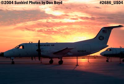 Corporate Air's EMB-120 N218AS on the ramp at sunset aviation stock photo #2686