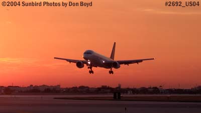 American Airlines B757-223 landing at sunset aviation stock photo #2692