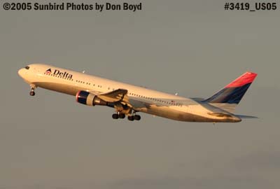 Delta Airlines B767-332/ER N178DZ takeoff on runway 30 at sunset aviation airline stock photo #3419