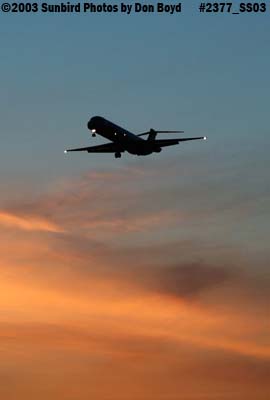 Unknown MD-80 on approach after sunset aviation stock photo #2377