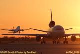 Cargo DC-10 taxiing as American Airlines B777-223 lifts off at sunset airliner aviation airline stock photo #4514