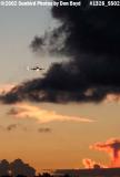 Twin-engine turboprop on approach after sunset aviation stock photo #1326