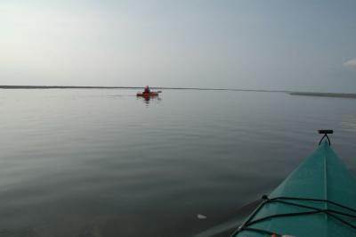 In the flat waters behind the sand bars