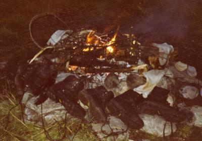 Drying the boots by the bonfire.jpg