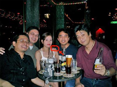 Gang with their friend...who's hand is that?