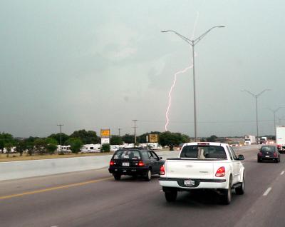 Photographing lightning from a moving vehicle.