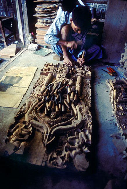 A woodcarver at work in Mandalay.