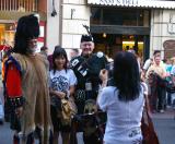 Scottish regiment with posing tourist