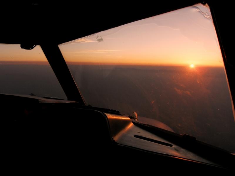 Flying into the sunrise