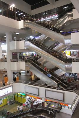 When you're near the top of the escalators, it gets considerable warmer all of a sudden. The non air-conditioned part of the shopping centre's up there.