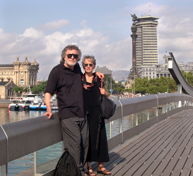 Judy and Richard on Rambla de Mar - on the waterfront, south of Las Ramblas. The Columbus monument is in the background.