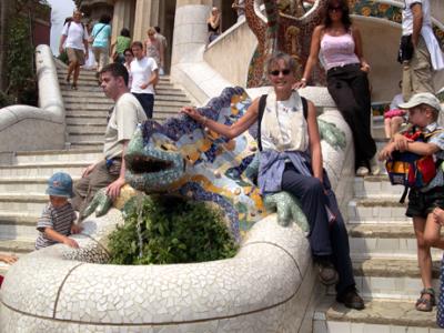 Judy next to the salamander (symbol of the park) in Parc Gell. Salamander covered with trencads - mosaic of broken glass.