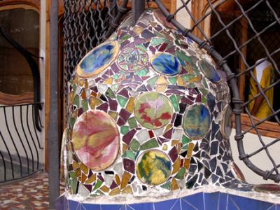 Gaud's Casa Batli: Decoration in the rear courtyard - themes and colors of nature (flowers, shells, blue, green).