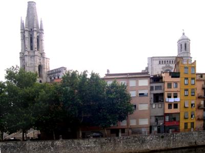 Chopped off belfry (by lightning) of the Church of Sant Feliu (left). Belfry of the cathedral (right) - in the Old Quarter.