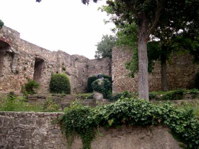 Gardens in back of the cathedral. Restored Roman wall is in the background.