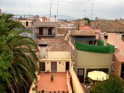 Rooftops in Figueres. Pyrenees Mountains in the background. (They separate the Iberian Peninsula from France).