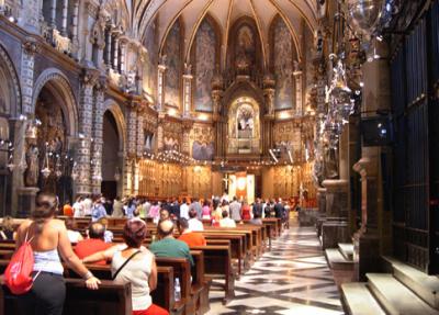 A wedding inside the basilica. The interior is decorated with many paintings by Catalan artists.