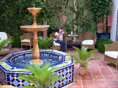 Judy having tea in the inner courtyard of our hotel, the Palacio Ca Sa Galesa