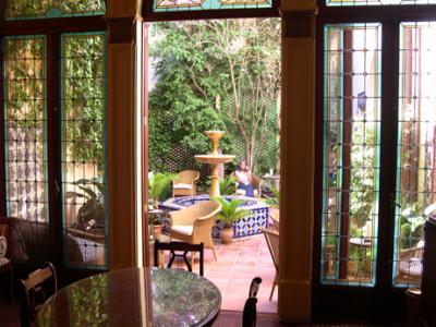 Entrance to the inner courtyard of our hotel, the Palacio Ca Sa Galesa - Judy having tea.