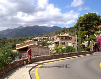 Judy on the road heading west from Fornalutx (in the background) on the island of Mallorca