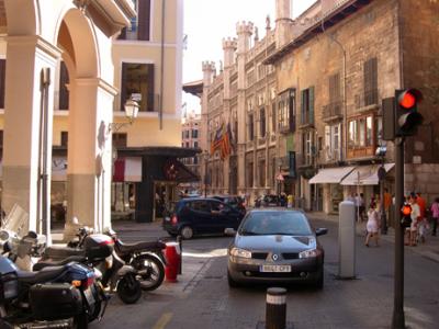 Street in Palma. Metal cylinder in street blocks entrance to the Old Quarter unless have a card pass - then cylinder lowers.