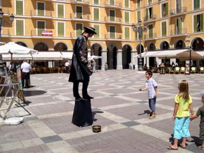 Boy dueling with a living statue of Zorro on Plaa Major in Palma.