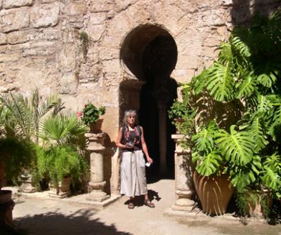 Judy in the gardens of Banys rabs (Arab Baths) - at the entrance to the Arab Baths, in the Old Quarter of Palma.