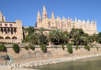 Palau de l'Almudaina (left) - built in 1300's on site of Arab fortress. Now used by Spanish royal family. The Cathedral (right).