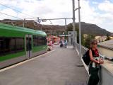 Judy taking a last look at Montserrat  from the train station at Monistrol - waiting for train to take us to Barcelona