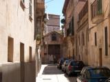 Entrance to a monastery at the end of a street in the Old Quarter of Palma