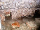 Arab Baths: Tepidarium (warm room) - steam from oven/broiler (holes to it shown) passed under the top layer of the floor.